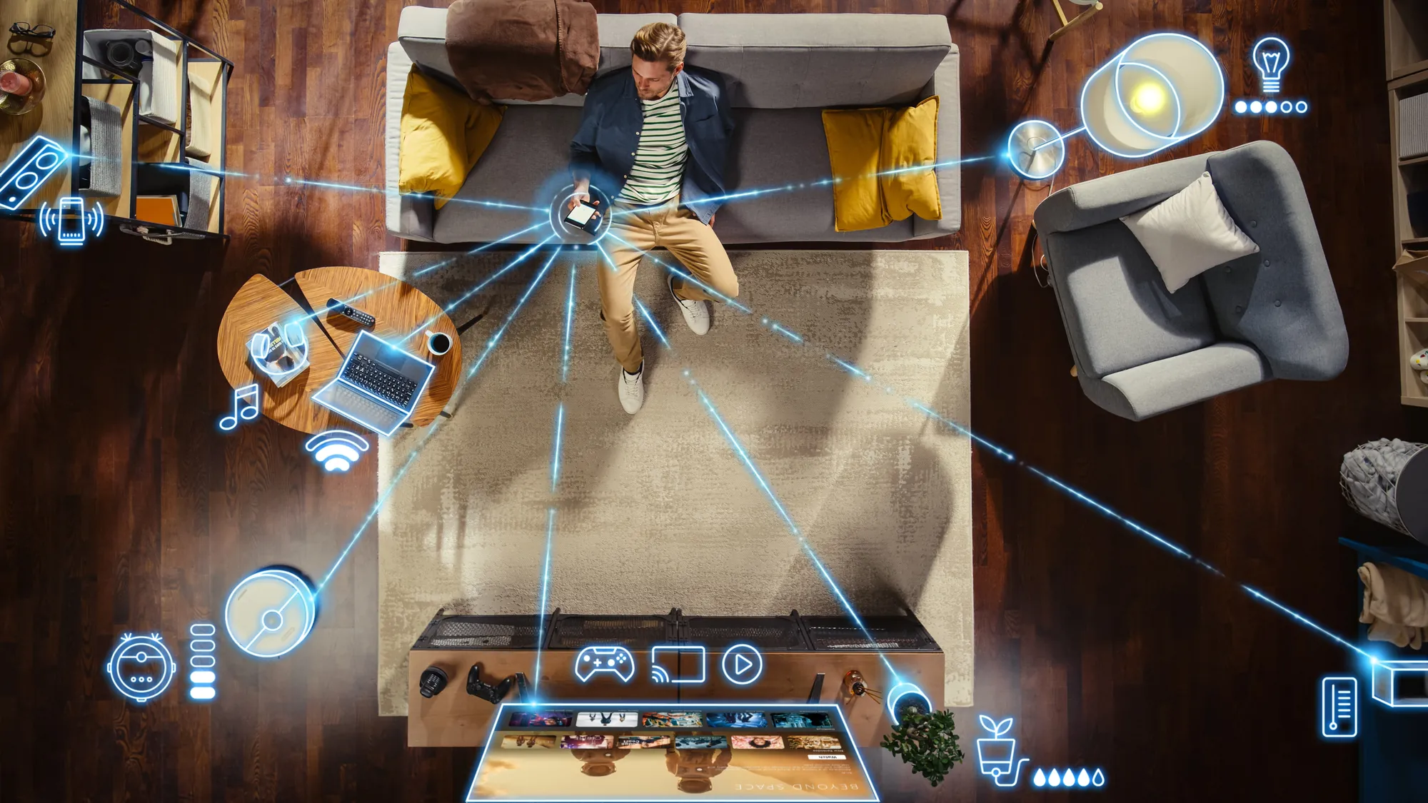 Overhead view of a person on a couch controlling a smart home from a phone, with glowing connections radiating to lights, speakers, a robot vacuum, a media console, a thermostat, and other connected devices