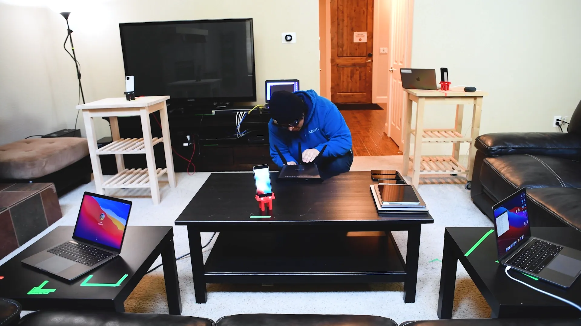 A tester validating connected devices in a residential test home