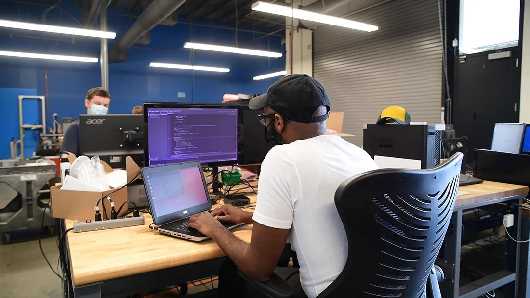 Novus Labs software developer at workstation